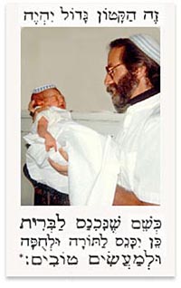 father holding infant son